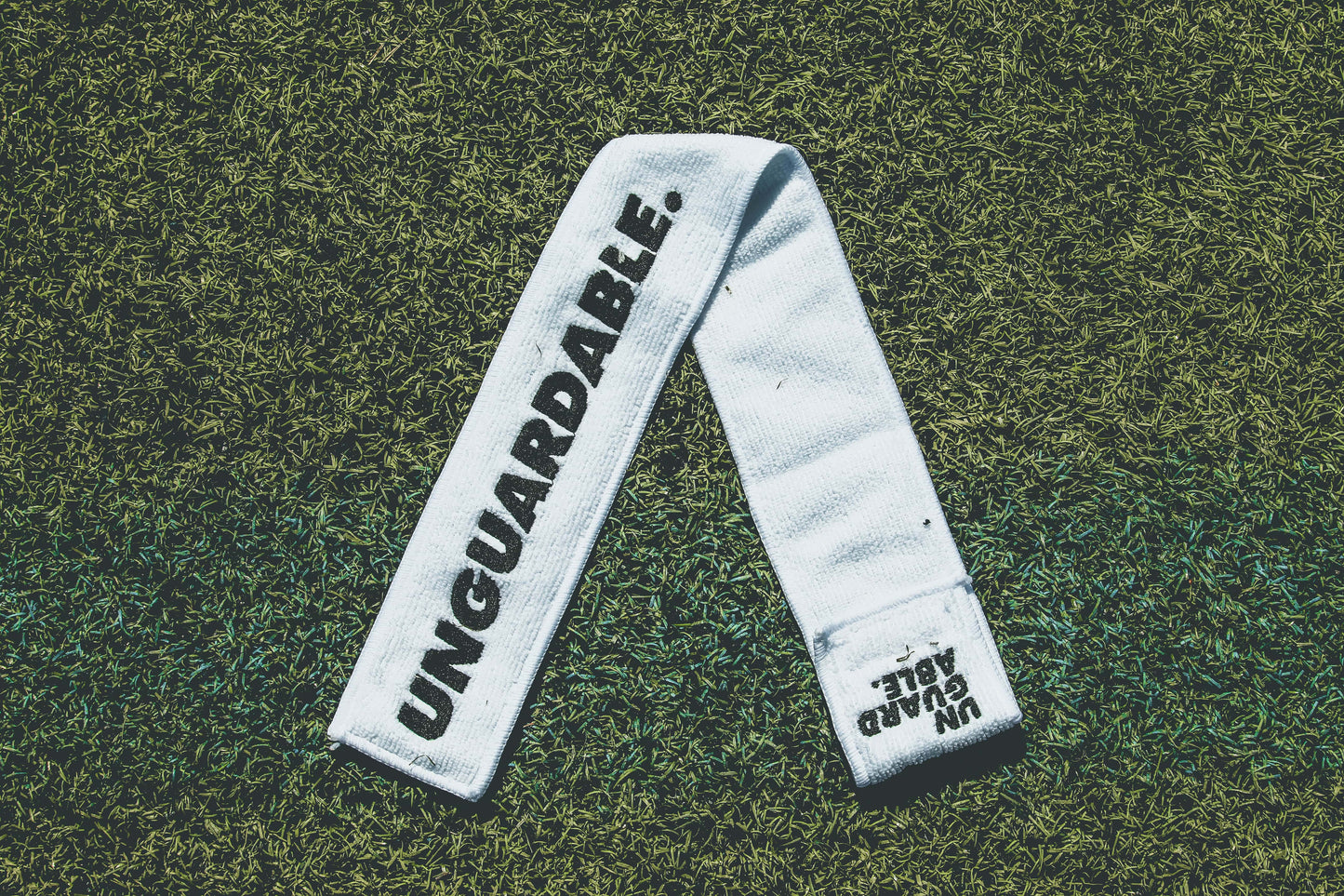 UNGUARDABLE Football Streamer Towel (White, Vertical Logo)